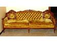 Carved wood sofa.