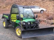 = $4, 250 = 2011 John Deere Gator 825i w/ Plow